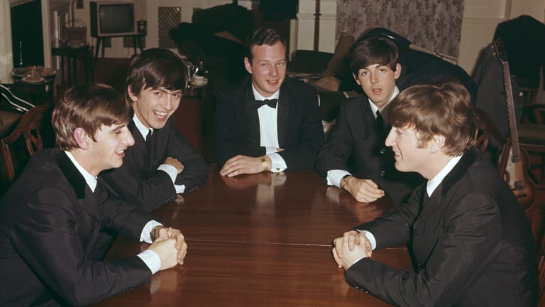 Brian Epstein with The Beatles.
