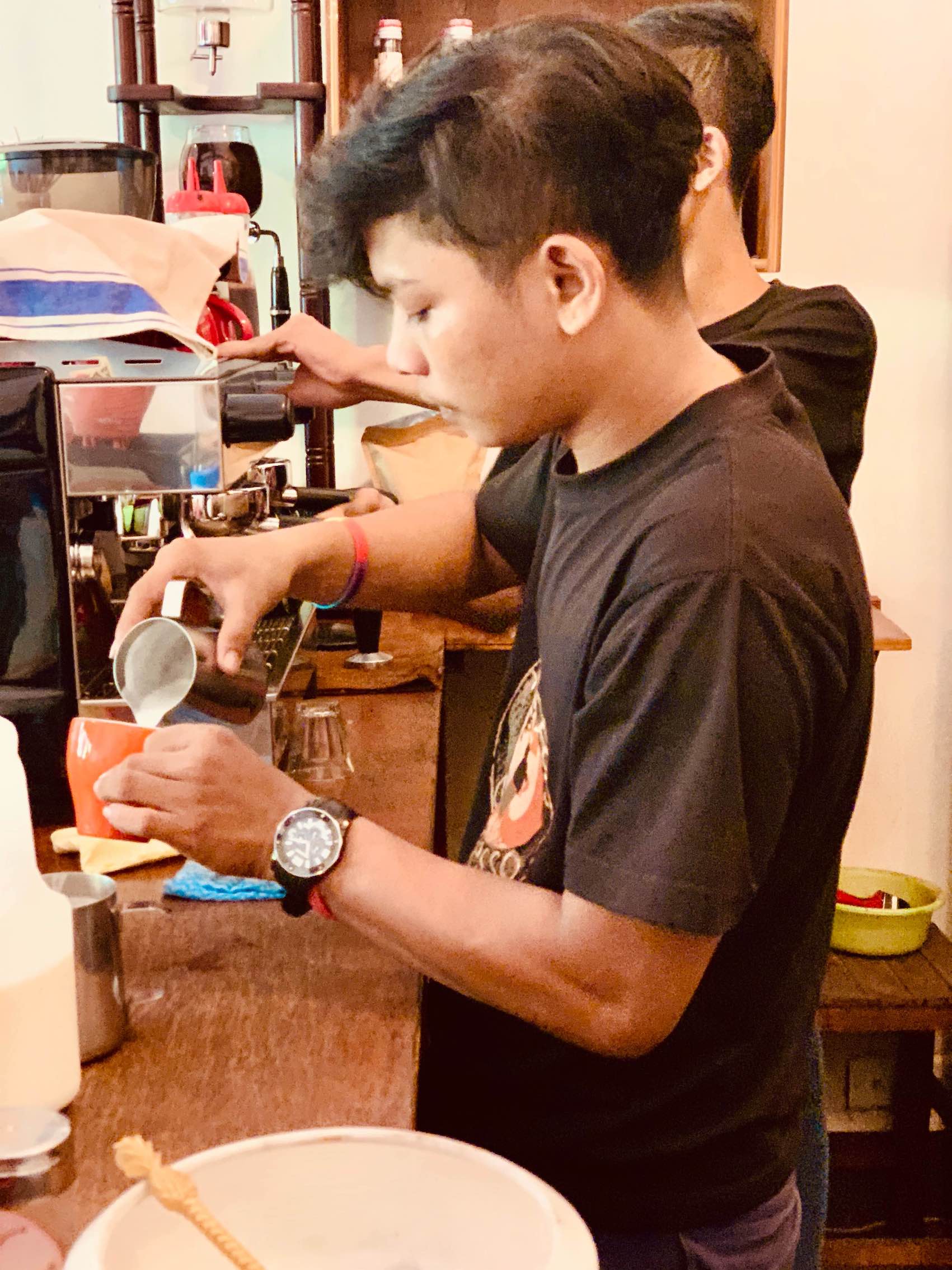 A Khmer barista at work Little Red Fox Espresso in Siem Reap