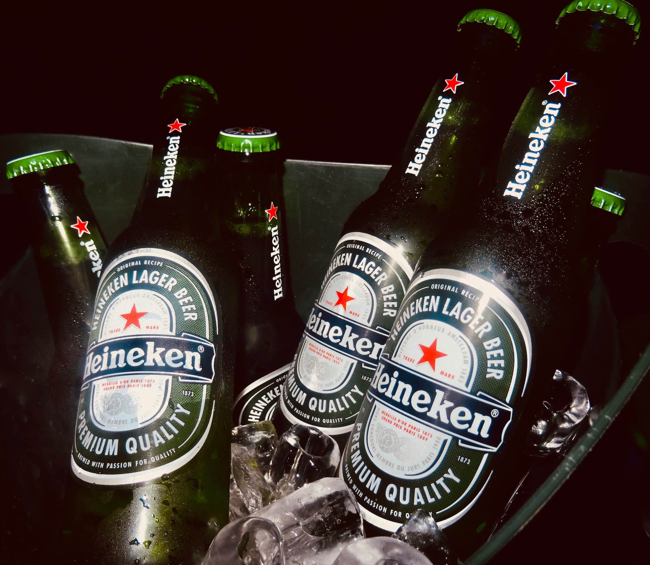 A bucket of Heineken in ice.