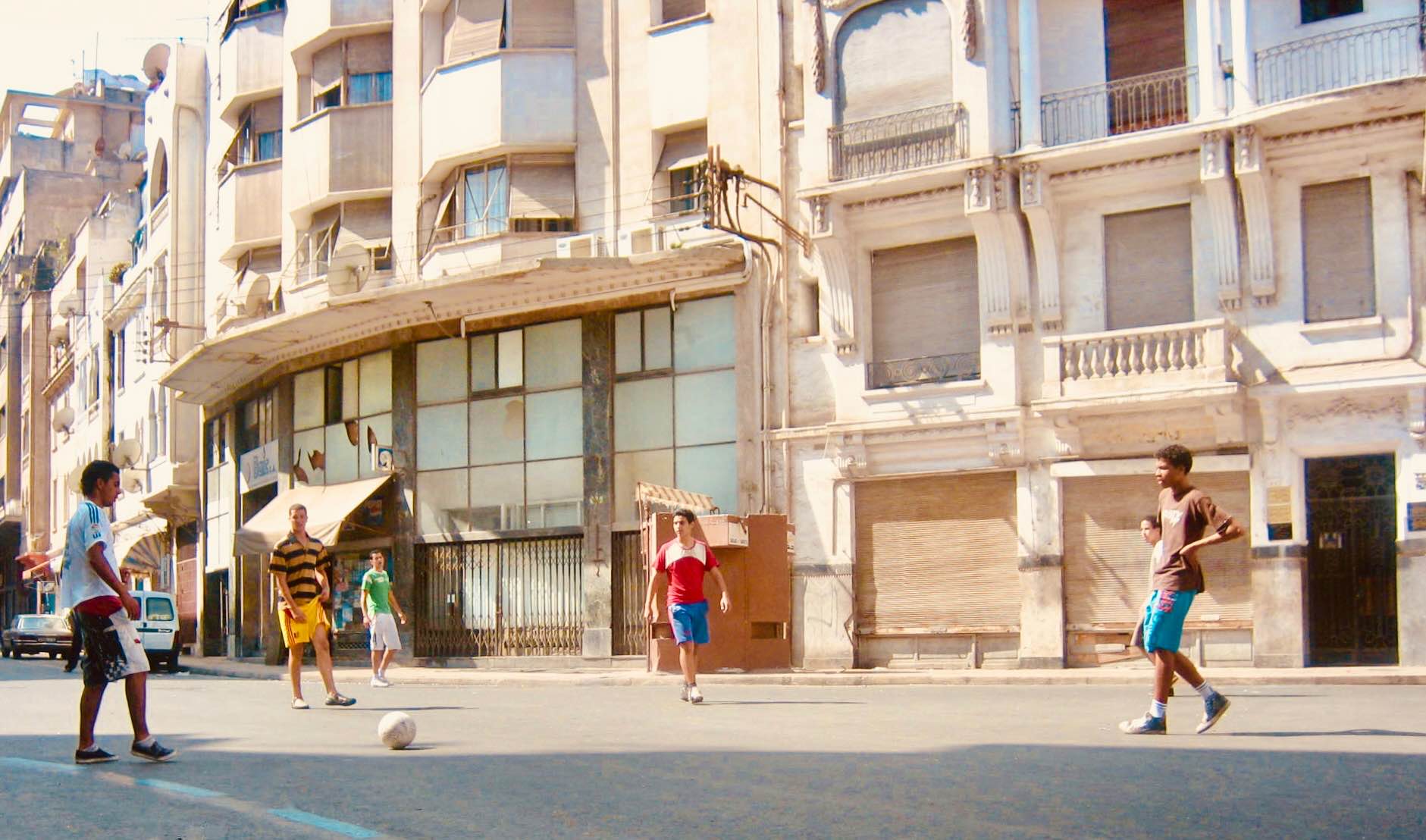 Teens playing football in the street Casablanca