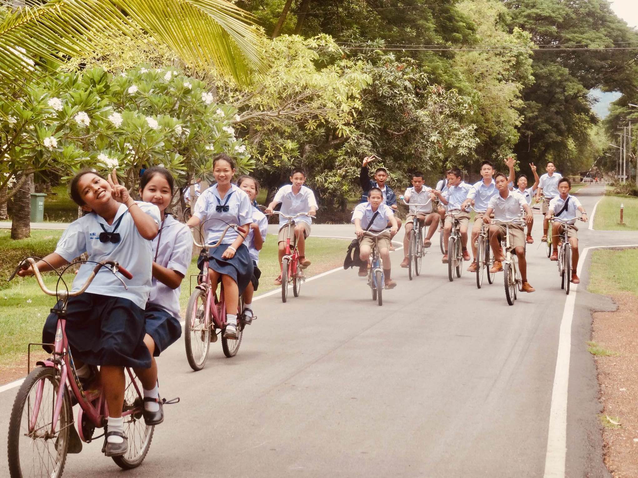 Schoolchildren cycling Sukhothai Thailand.