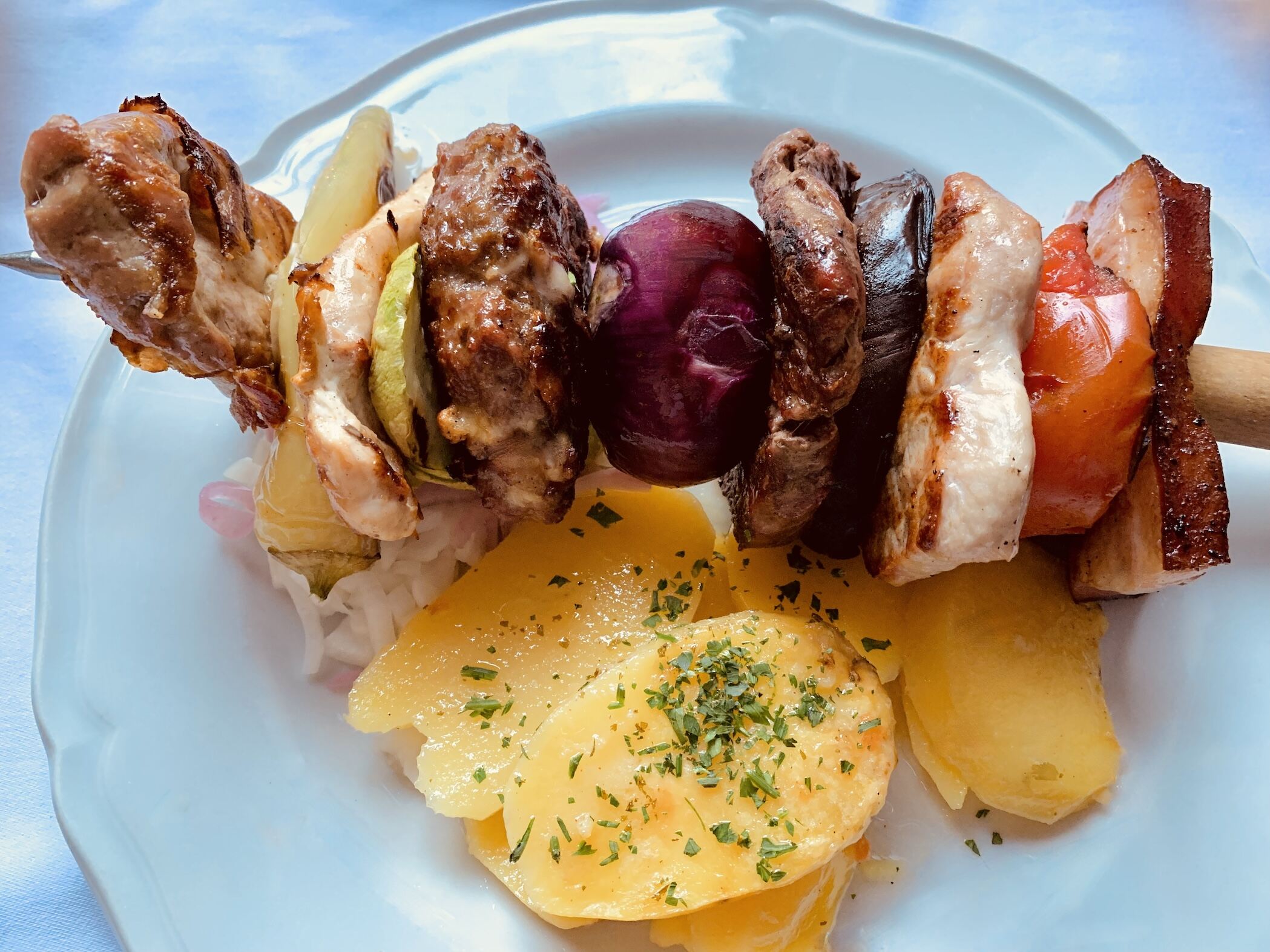 Mixed meat skewers at the Three Hats restaurant in Belgrade